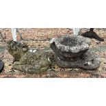 Stone pig together with a stone planter in the form of boot