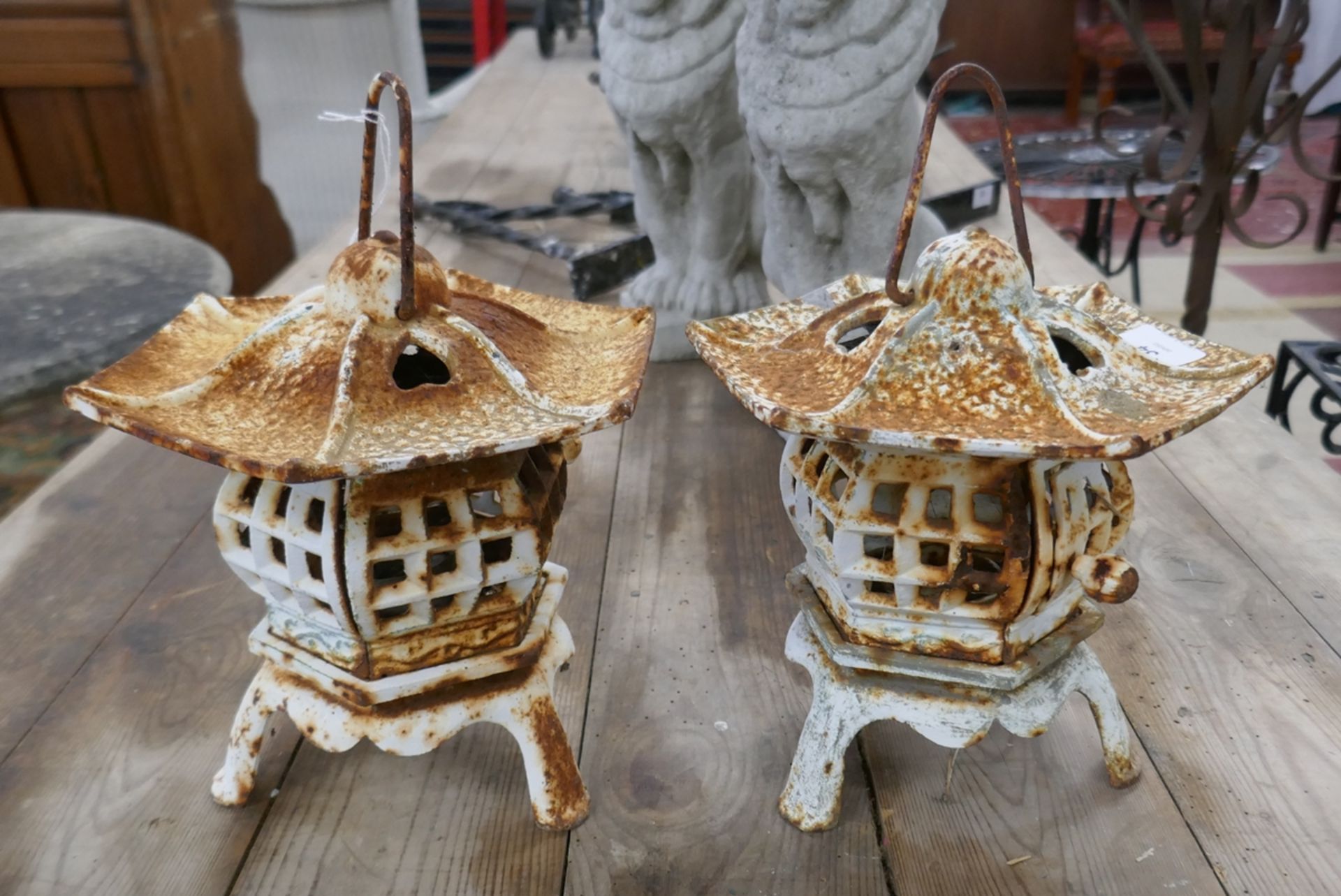 Pair of cast iron Oriental candle lanterns