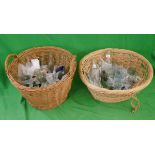 Old glass bottles and pots in 2 wicker baskets