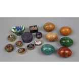 Collection of pill boxes together with stone eggs