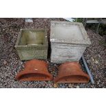 2 square stone planters together with 2 wall mounted terracotta planters