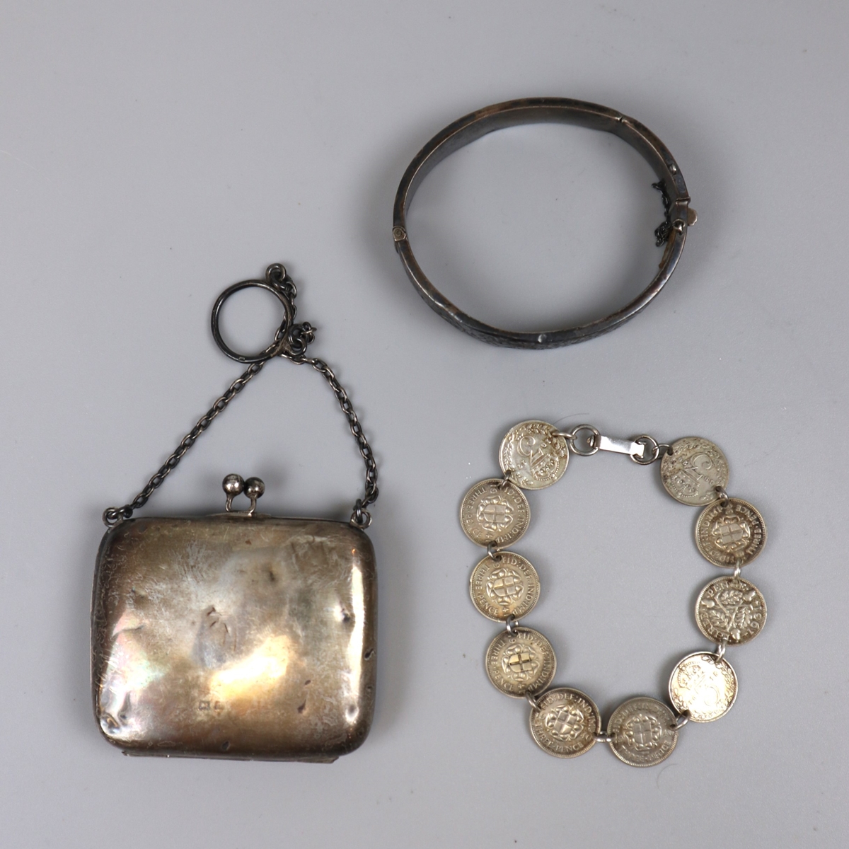 Collection of silver to include small purse on chain, child's bangle in original box and bracelet