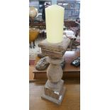 Large wooden candle stick with candle