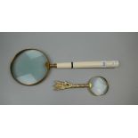 Large magnifying glass together with another