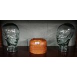 2 glass busts together with hat stand