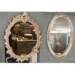 2 ornate oval mirrors