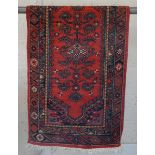 Small red patterned rug - Approx size: 69cm x 136cm