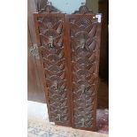 Pair of carved panels with coat hooks