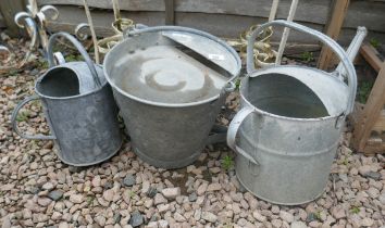 2 galvanised watering cans together with galvanised poultry drinking bucket