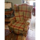 Upholstered wing back armchair