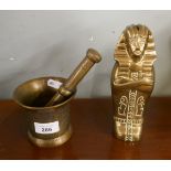 Brass pestle and mortar together with a Tutankhamun sarcophagus money box