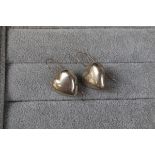 Pair of silver heart shaped earrings