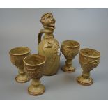 Pottery monk decanter with 4 goblets