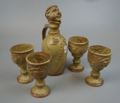 Pottery monk decanter with 4 goblets