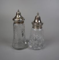 2 cut glass and silver topped sugar shakers