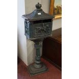 Cast iron post box on stand