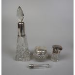 4 cut glass silver topped bottles