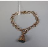 15ct gold bracelet (approx weight 18g) with a 15ct seal charm (approx weight 7.1g)