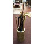 Stick stand together with collection of walking sticks