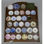 Collection of miniature plates on display rack