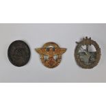 3 German badges to include - WW2 wound badge in black.ÿ Coastal artillery badge and WW2 German