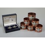 Hammered copper napkin rings with Para Reg badge together with a set of Para cufflinks