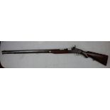 Antique flintlock rifle with ram rod