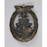 German battleship breast badge together with a photo of its owner