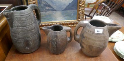 3 antique graduated wooden jugs