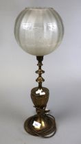 Brass table lamp with etched glass globe shade
