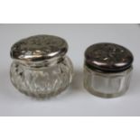 2 silver topped glass pots