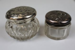 2 silver topped glass pots