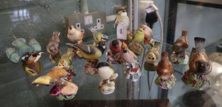 A large quantity of Royal Worcester bird figurines