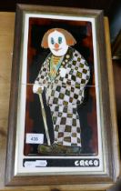 Framed Majolica clown tiles marked Greco