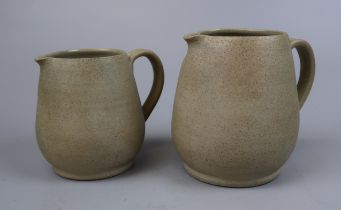 2 graduated pottery jugs