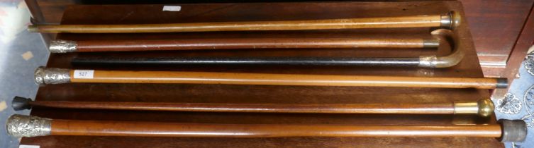 Collection of walking sticks to include silver topped