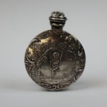 A small silver scent bottle