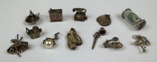 11 assorted silver charms