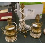 Pair of brass antique lamps and another