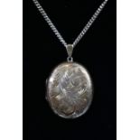 Large silver locket on chain