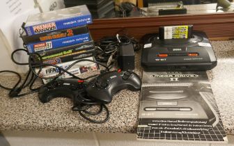 Sega Mega Drive II complete in working order with games and manual
