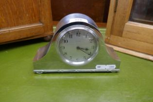 Silverplated 'Napoleon Hat' style mantel clock circa 1930 with white dial and Arabic numbers. A