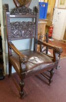 Antique carved armchair adorned with lions