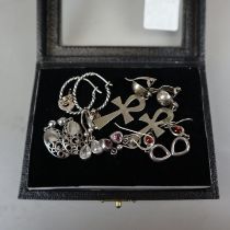 7 pairs of silver earrings