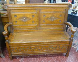 Carved oak bench with integrated storage - Approx size: W: 135cm D: 49cm H: 102cm