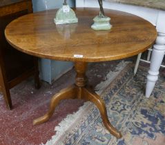 Circular oak tripod table