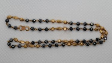 Yellow metal stone set necklace