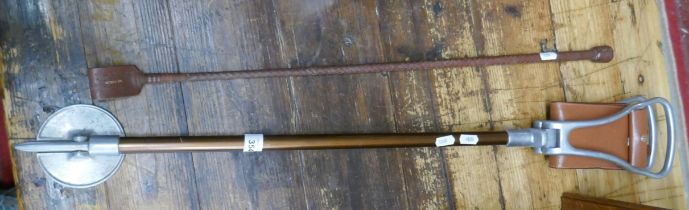 Shooting stick together with a leather riding crop