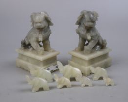 Pair of carved soapstone dog of Foo together with carved elephants