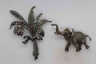 Silver Elephant brooch together with a silver and marcasite spray brooch